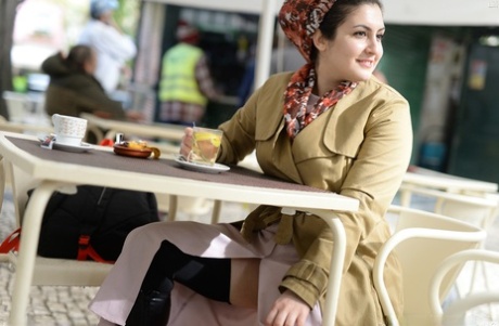 Brunette plumper shows her upskirt twat with a strand of pearls wedged in slit