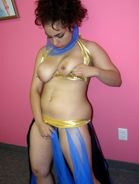 Arabian belly dancer Lena Love fondles her big tits and rubs her pussy