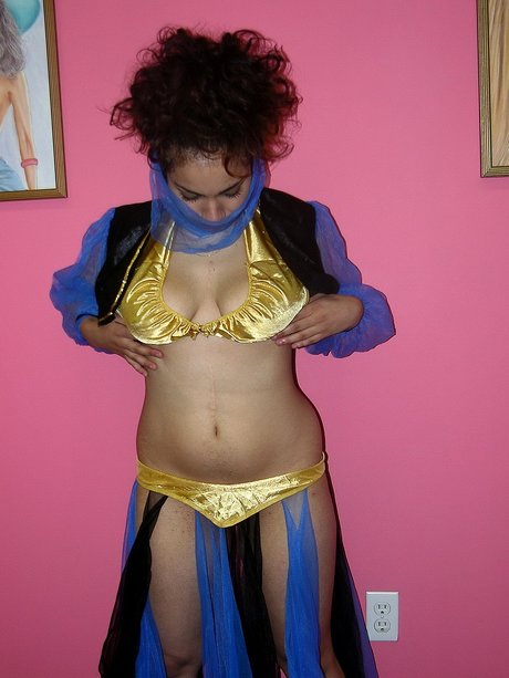 Arabian belly dancer Lena Love fondles her big tits and rubs her pussy