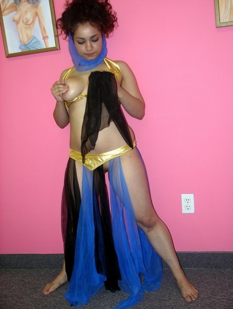 Arabian belly dancer Lena Love fondles her big tits and rubs her pussy