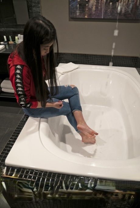 Adorable Asian cutie Jade Kush bares small boobs in front of her well hung man