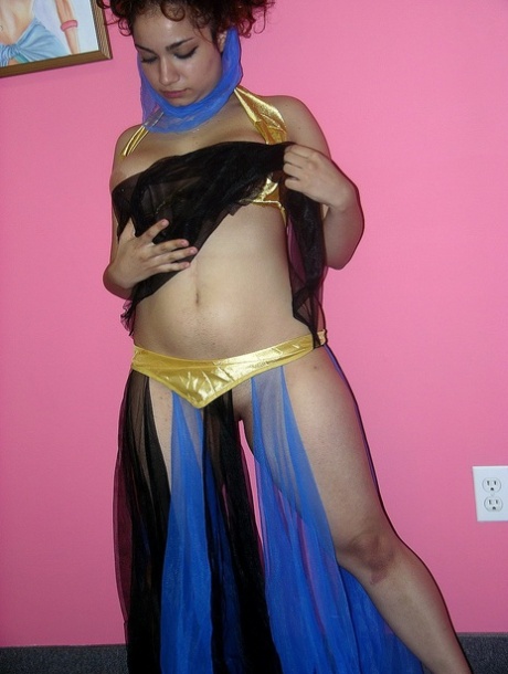 Arabian belly dancer Lena Love fondles her big tits and rubs her pussy